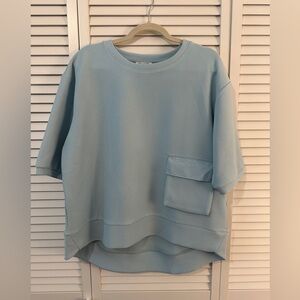 Joh. Apparel top in pale blue.  Size small.  NWT.